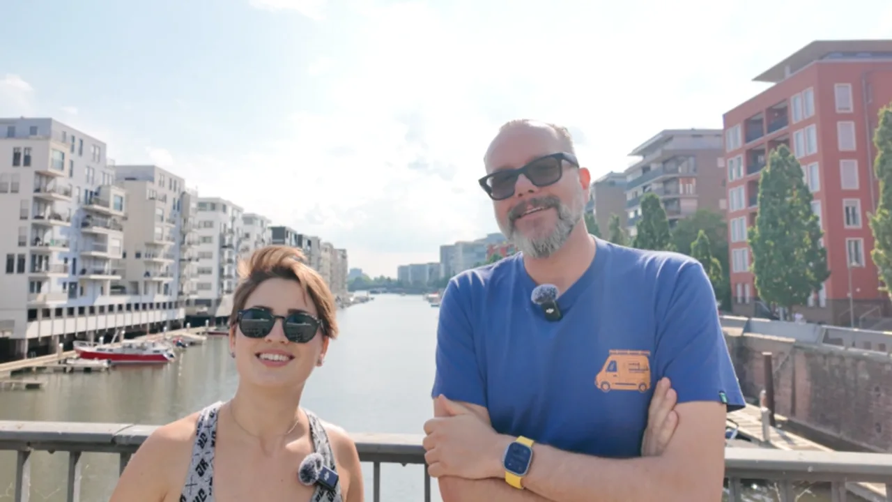 Maraja Fistanić and Pascal Di Prima standing on a bridge, about to discuss the Bot Scheduler feature